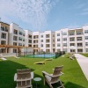 view of four story apartment building from activity courtyard