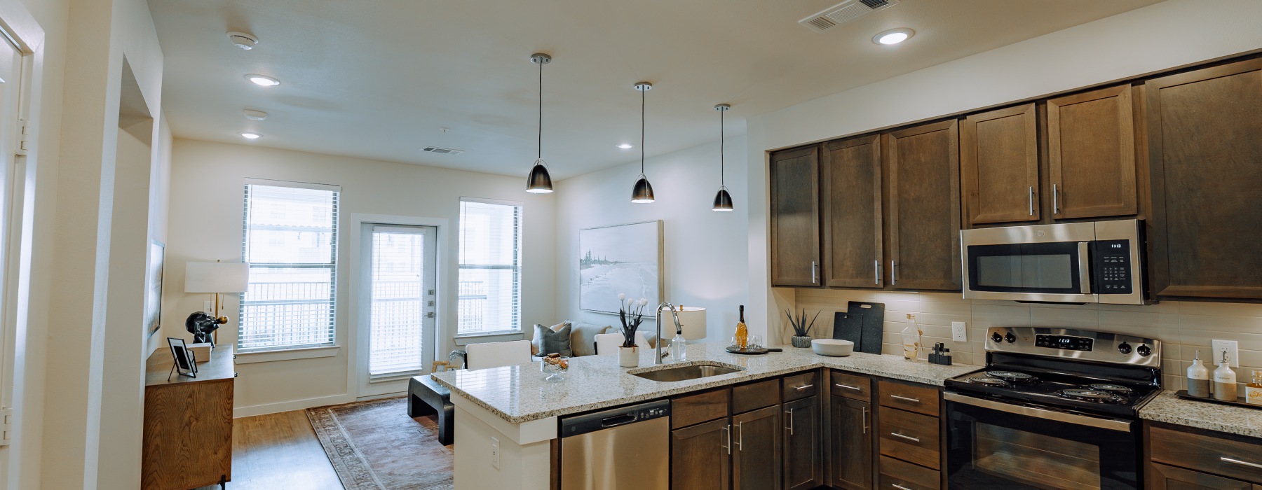 an open kitchen with stainless appliances and design finishes