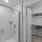 bathroom with walk-in closet and shower