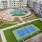 overhead view of courtyard with tennis court and pool