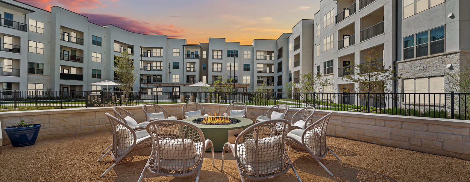 outdoor fire pit surrounded by chairs