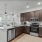 an open kitchen with stainless appliances and design finishes