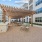 tables and chairs under pergola
