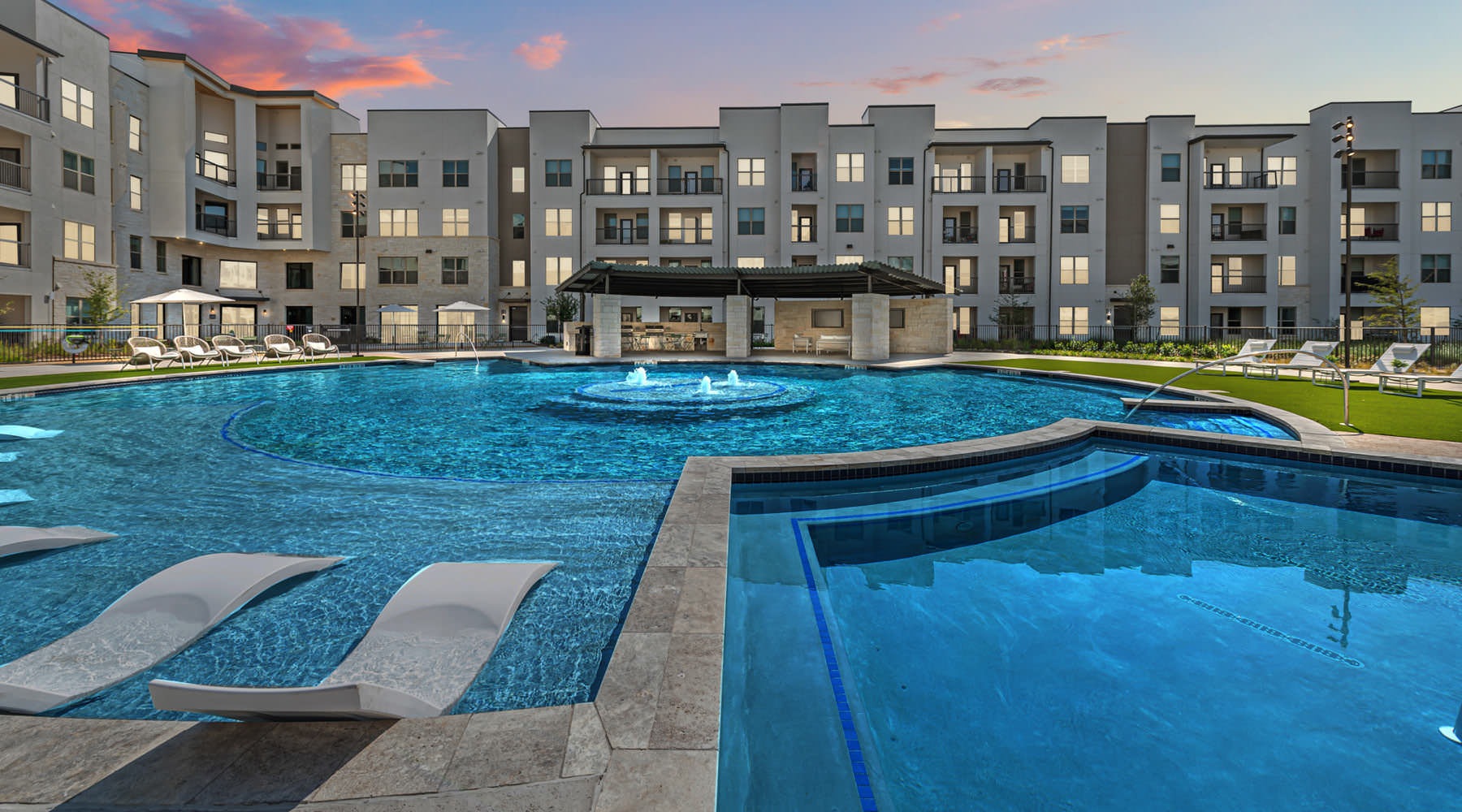 Live Beautifully round pool with in-pool lounge chairs